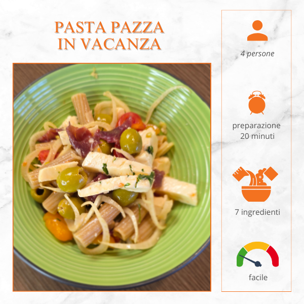 Piatto di pasta fredda con formaggio, olive, pomodorini e prosciutto crudo, ricetta estiva fresca e veloce